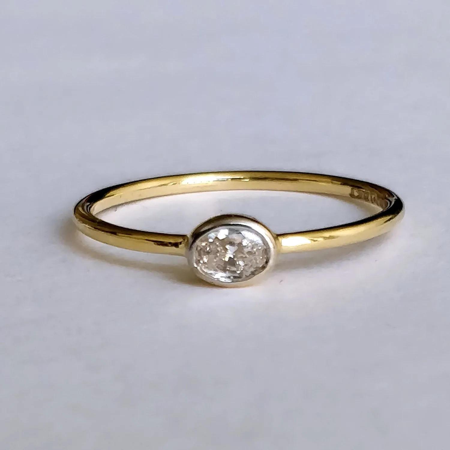 East West Minimal Bezel Set Oval Diamond Ring