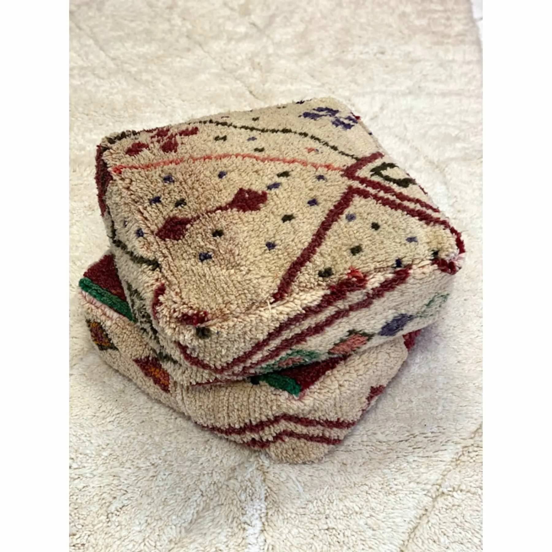 Off-white Moroccan floor pouf with colorful details