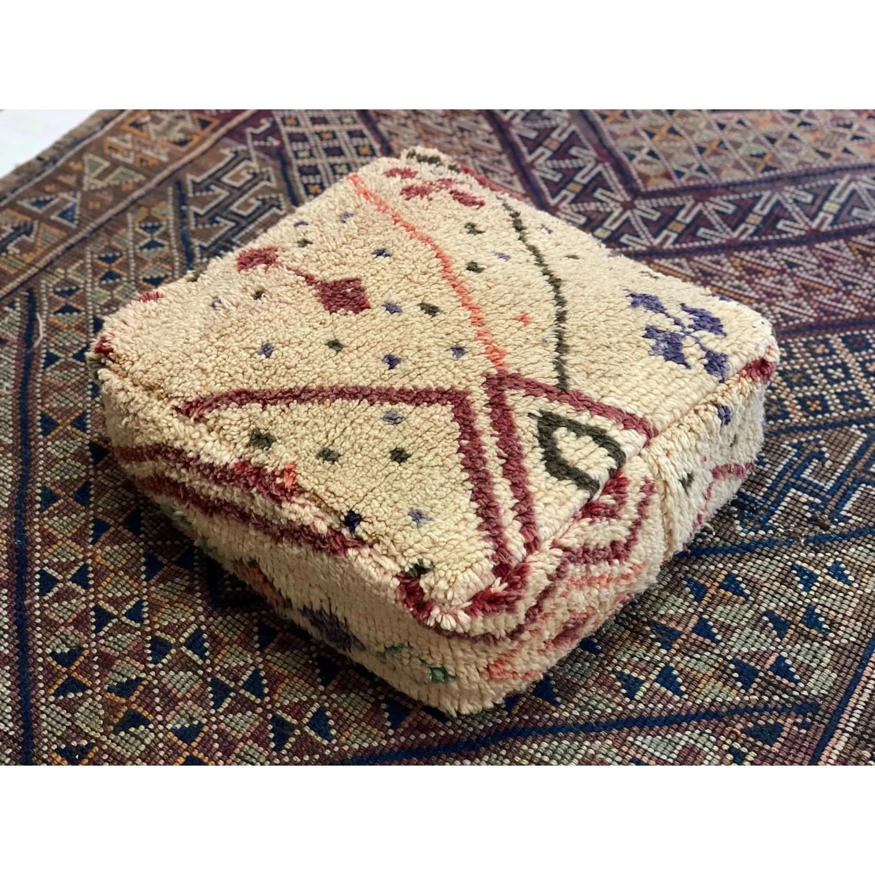 Off-white Moroccan floor pouf with colorful details